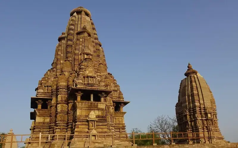 Historic temples and landscapes of Madhya Pradesh with ancient architecture under clear skies.